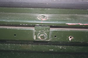 Inside bolt location on the bottom of the side panel