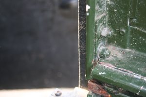 These bolts are just inside the rear door on either side