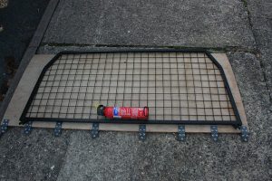Using the dog guard as a template for the plywood