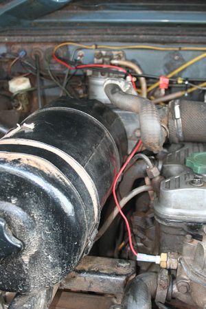 The new VDO sender in place, with the new wire (red) heading through the bulkhead