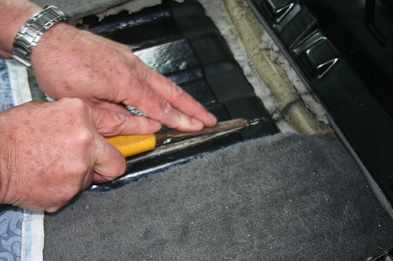 The angle grinder will warm up the black bitumen so it can scraped off