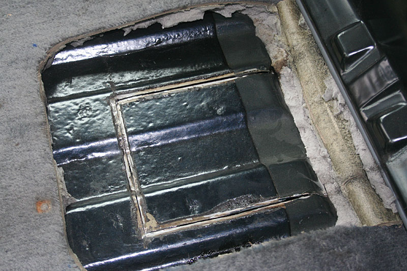 The metal flap back in place