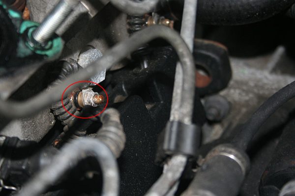 Location of one of the glow plugs, showing the electrical connection and 8mm nut