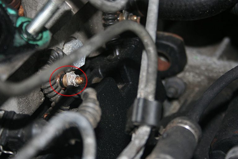 Location of one of the glow plugs, showing the electrical connection and 8mm nut