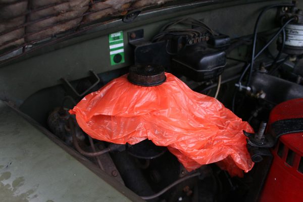 Some plastic secured over the brake fluid reservoir helps creat a vacuum to keep the fluid in the system