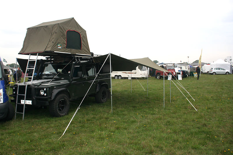 A lovely looking 110 with roof tent and awning
